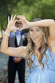 Attractive Teenage Prom Couple Forming Hand Heart