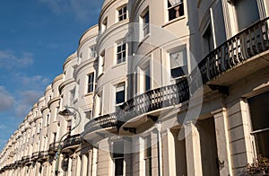 Attractive terraced properties in Lansdowne Place, Hove, East Sussex, UK. The stucco fronted buildings are built in Regency style.