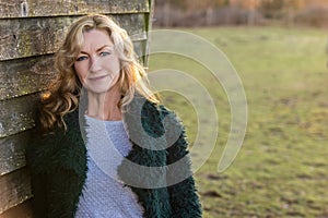 Attractive Thoughtful Middle Aged Woman Outside in Golden Sunshine