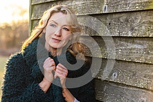 Attractive Thoughtful Middle Aged Woman Outside in Golden Sunshine