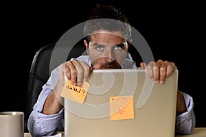 Attractive tired businessman in shirt and tie tired overwhelmed heavy work load exhausted at office