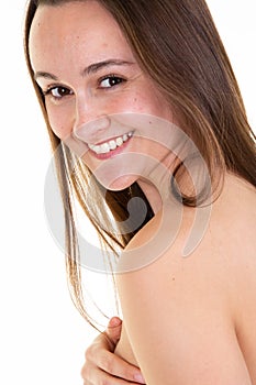 Attractive topless young woman poses in front of white background