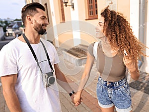 Happy smiling tourists walking and enjoying the view