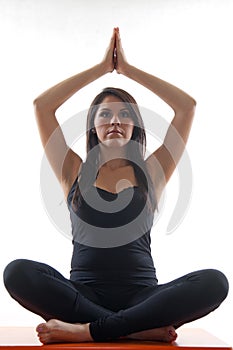 Attractive twenties hispanic woman doing yoga