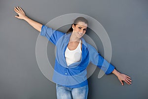 Attractive woman with arms wide open