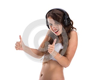 Attractive woman with beautiful body posing with headphones