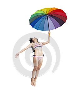 Attractive woman in bikini jumping