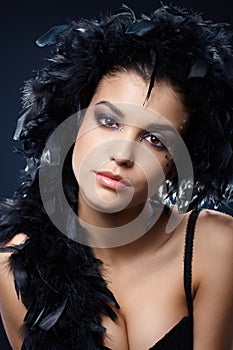 Attractive woman with black feather boa