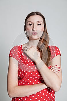 Attractive woman blowing kiss