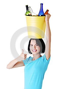 Attractive woman with bottles, recycling idea.