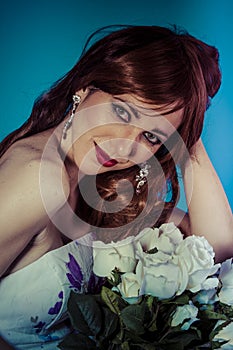 Attractive woman with bouquet of white roses