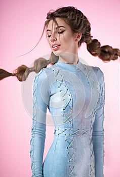 Attractive woman with braids wearing blue jumpsuit