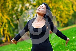 Attractive woman breathing outside