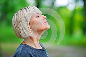 Attractive woman breathing and relaxing