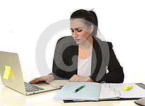 Attractive woman in business suit working tired and bored in office computer desk looking sad