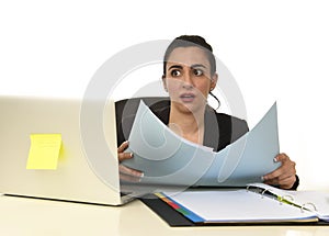 Attractive woman in business suit working tired and bored in office computer desk looking sad