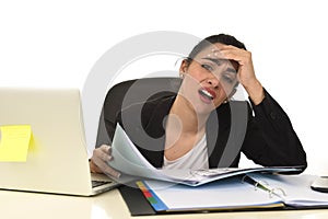 Attractive woman in business suit working tired and bored in office computer desk looking sad