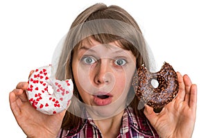 Attractive woman is choosing between two donuts