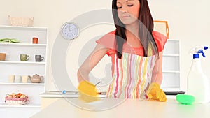 Attractive woman cleaning the kitchen