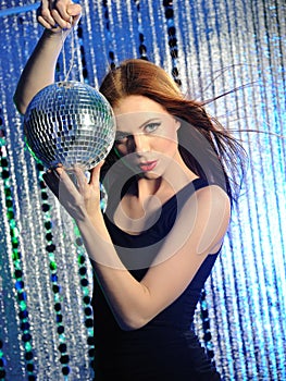 Attractive woman clubbing, dancing in disco