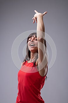 Attractive woman dancing and singing