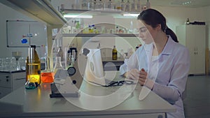 Attractive woman doctor working in laboratory.