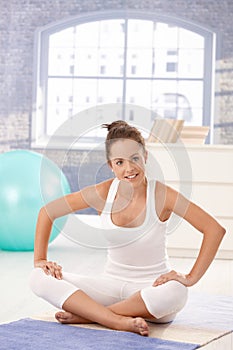 Attractive woman doing exercises on floor