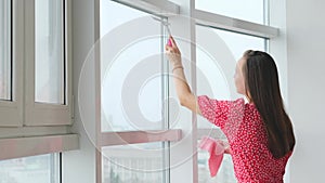 Attractive woman doing housework, washing big okgas at home. Housekeeping concept.