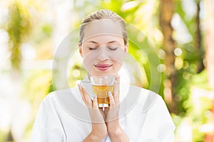 Attractive woman drinking tea