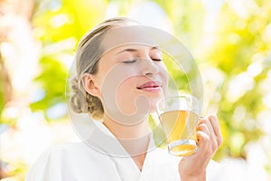 Attractive woman drinking tea