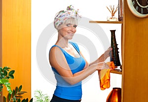 Attractive woman dusting