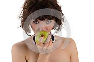 Attractive woman eating green apple