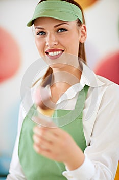 Attractive woman employed in candy store photo