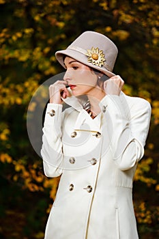 Attractive woman in evening autumn park