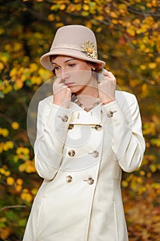 Attractive woman in evening autumn park