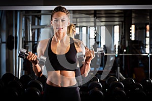 Attractive woman exercising at the gym.