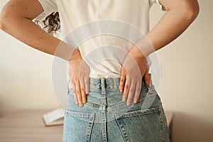 Attractive woman feel backache spine pain because of UTI pyelonephritis disease. Kidney infection pyelonephritis urinary