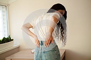 Attractive woman feel backache spine pain because of UTI pyelonephritis disease. Kidney infection pyelonephritis urinary