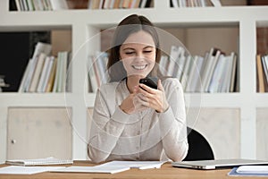 Attractive woman feels happy received positive news message