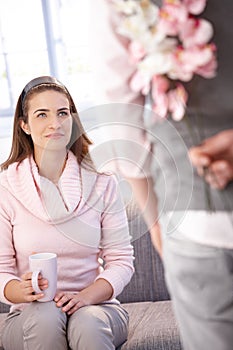 Attractive woman getting flowers from man