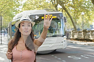 attractive woman hailing bus