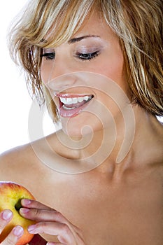 Attractive woman holding an apple, promoting healthy lifestyle