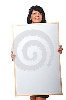 Attractive woman holding big blank banner