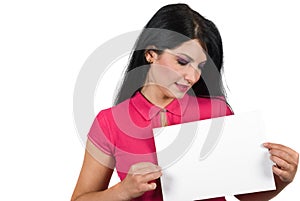 Attractive woman holding a blank page