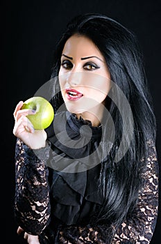 Attractive woman holding green apple