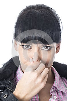Attractive Woman Holding Her Nose to Stop a Bad Smell or Aroma