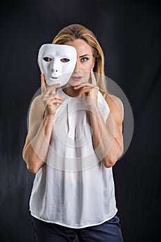 Woman holding theatre mask