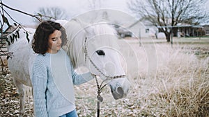 Attractive woman with a horse outdoor