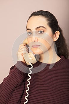 Attractive woman listening to a phone conversation
