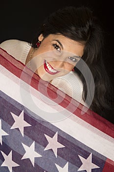 Attractive woman looking over the American stars and stripes